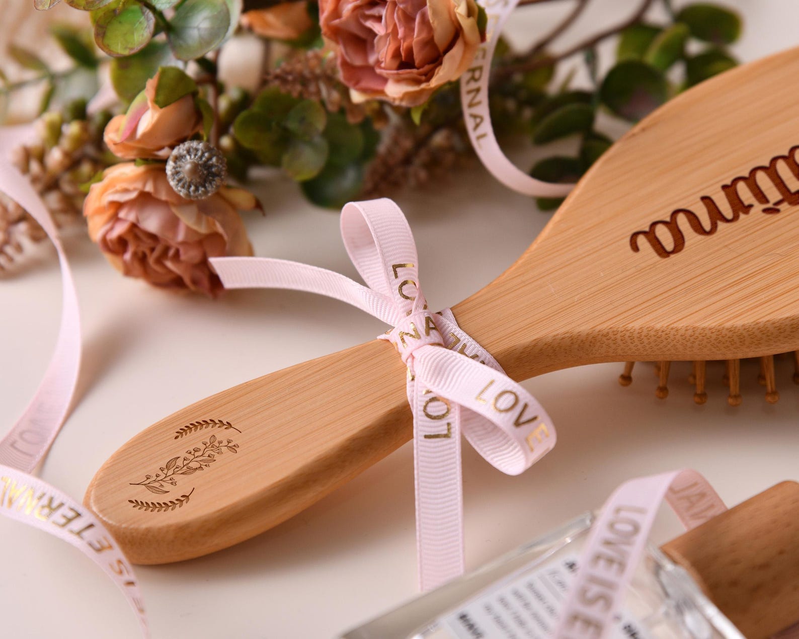Comb resting on wedding invitation suite, highlighting its gift-ready aesthetic