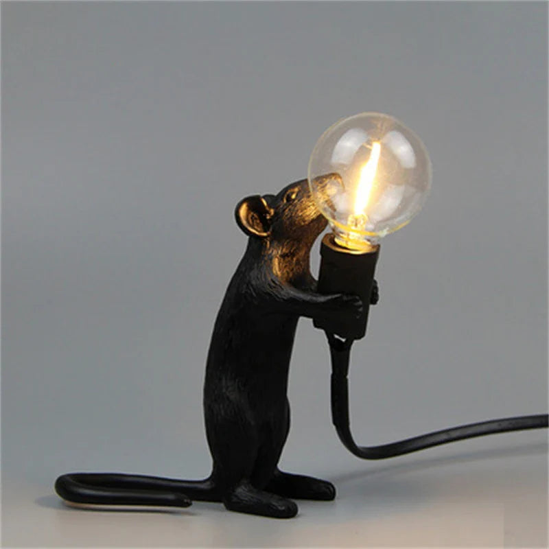 Night Rat lamp illuminated in a dark room showing warm tone