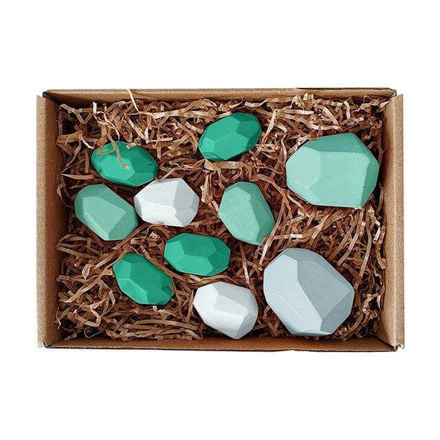 Colorful stones in a spread on a play mat