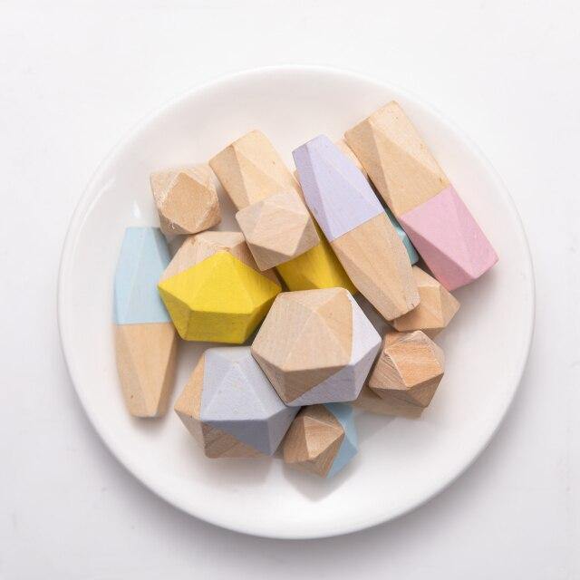 Stones paired with a small instruction card for challenge prompts