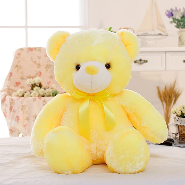 Bear sitting upright showing plush stitching and LED core