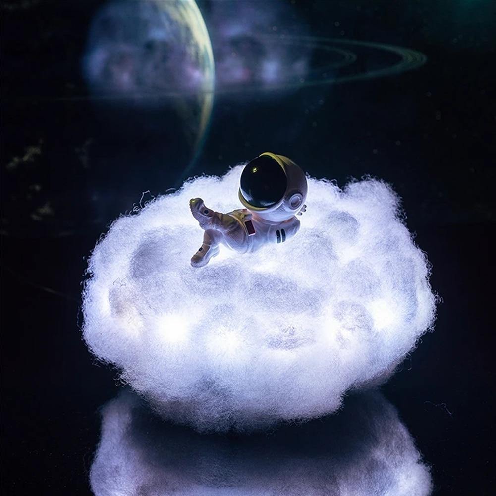 Astronaut night light in a nursery casting gentle colored clouds