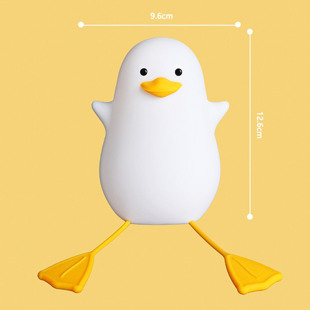 Happy Duck lamp sitting beside a child