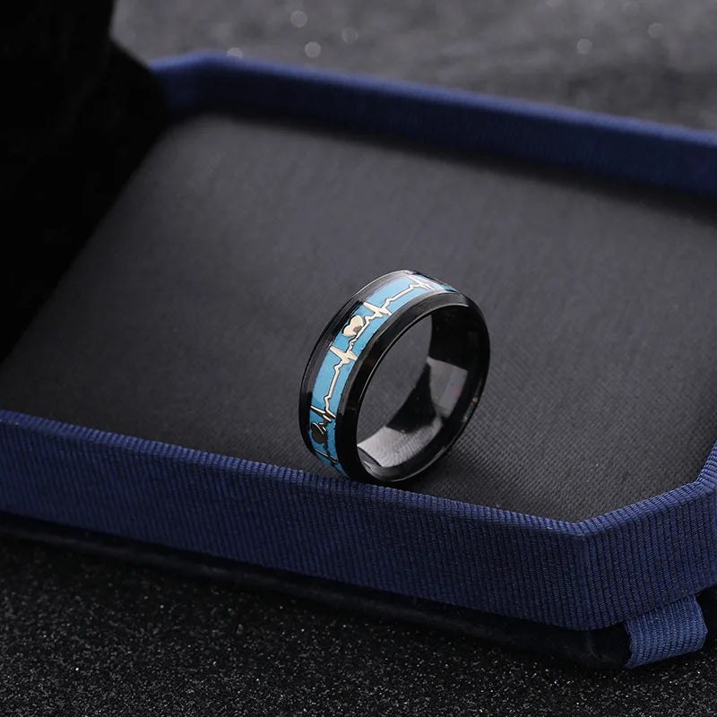 Ring detail showing heartbeat engraving under magnification