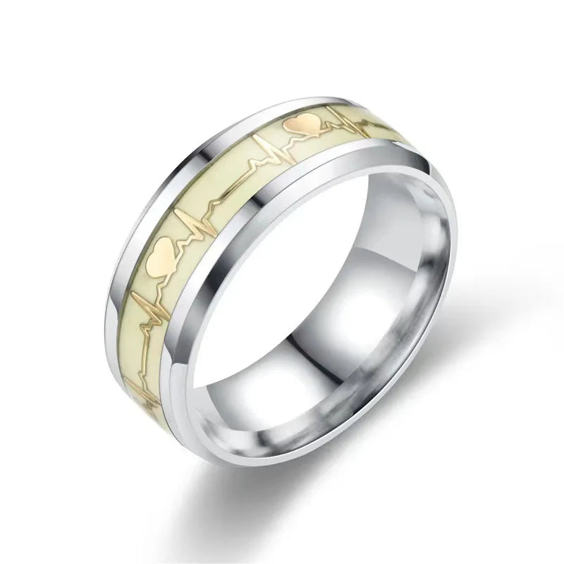 Two rings placed on a wooden surface emphasizing natural tones
