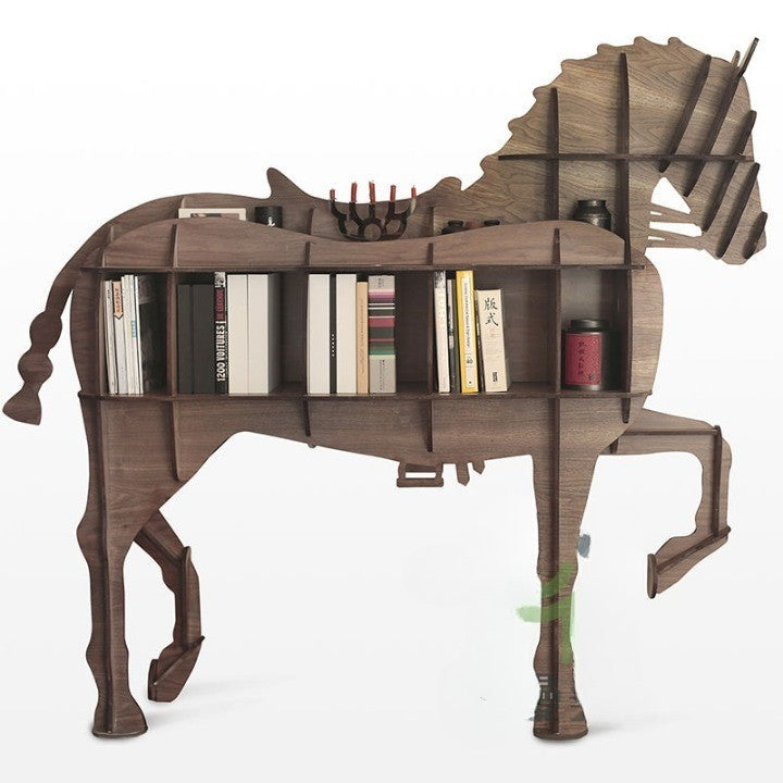 Decorative view: horse bookshelf styled with art, frames, and curios