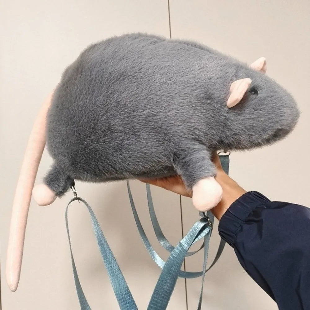 Close-up of the mouse's embroidered face and ears on the backpack