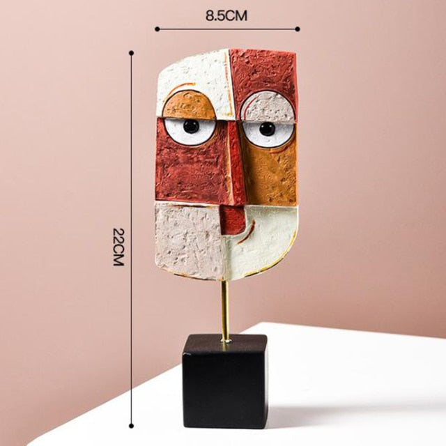 Sculpture staged beside a stack of design books