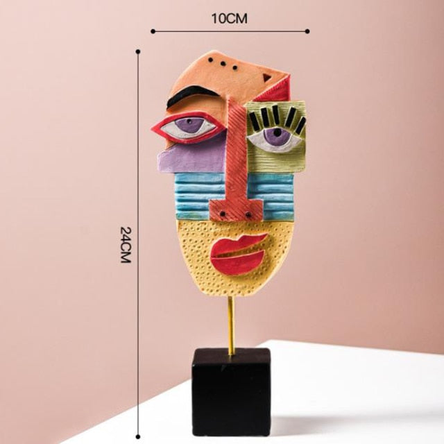 Sculpture in a cozy vignette with soft textiles