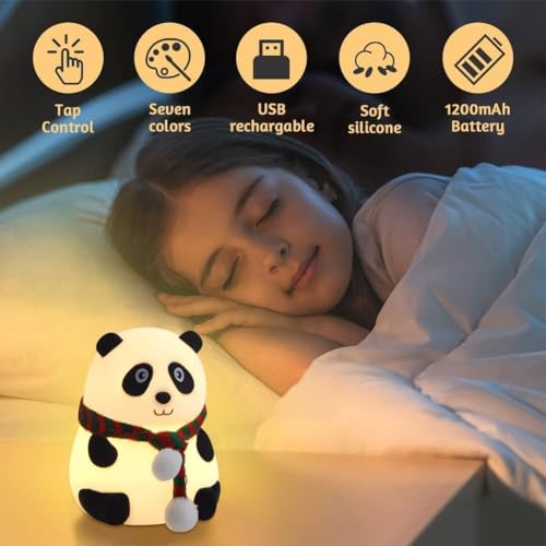 Panda night light glowing beside stuffed toys