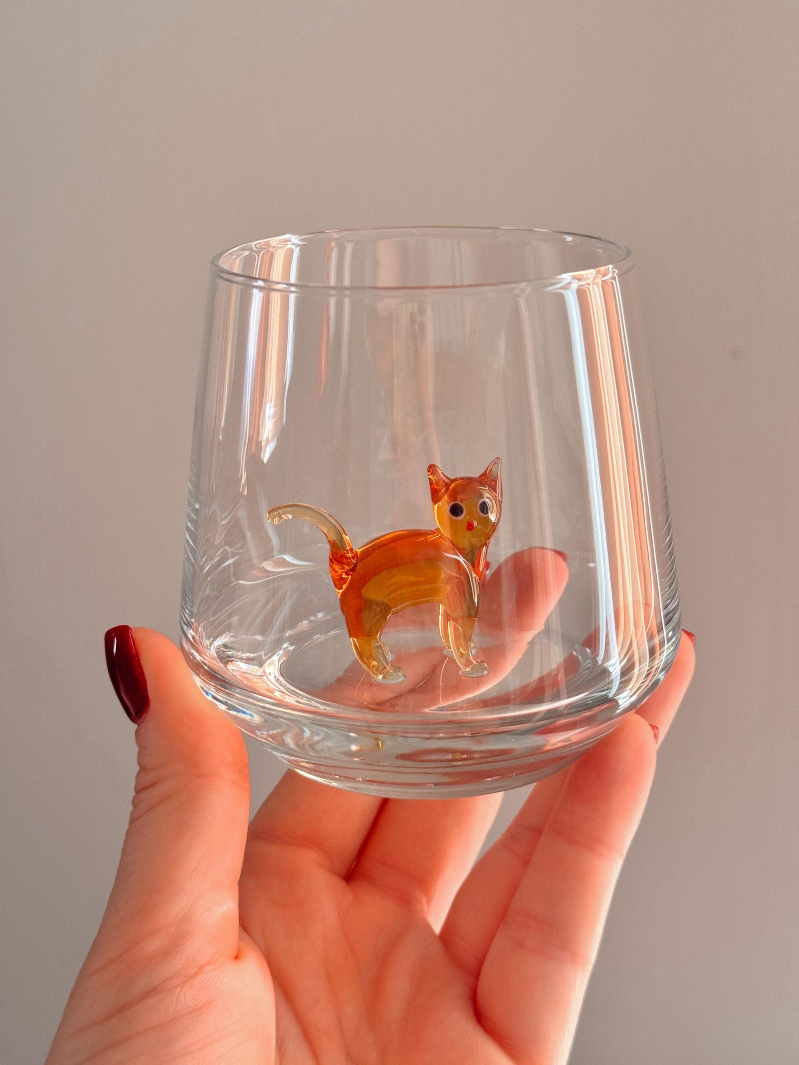 Artful angle showing kitty details inside the glass