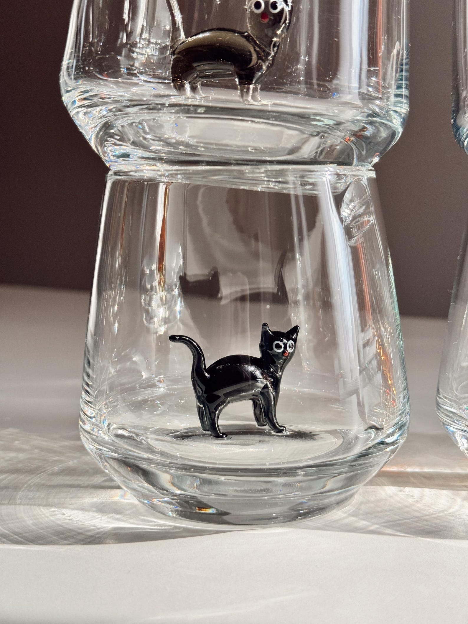 Decorative table setting featuring the cat glass as accent glassware