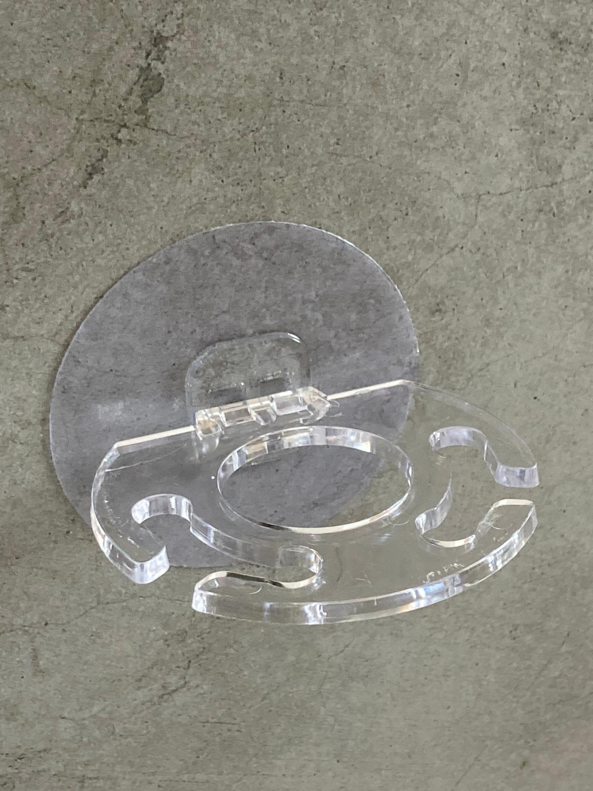 Porte-brosse à dents et dentifrice mural adhésif transparent discret vue trois quart.