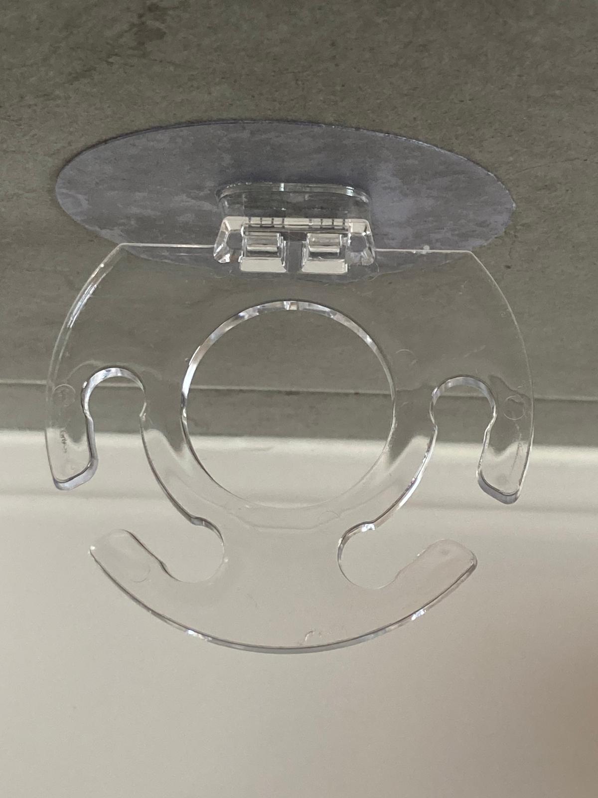 Porte-brosse à dents et dentifrice mural adhésif transparent discret vue du dessus transparent.