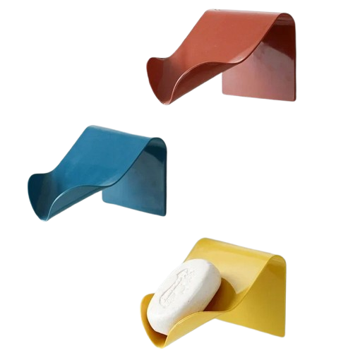 Supports savon solide bleu, jaune, rouge fixés au mur.