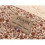 Étiquette artisanale sur pochette fleurie