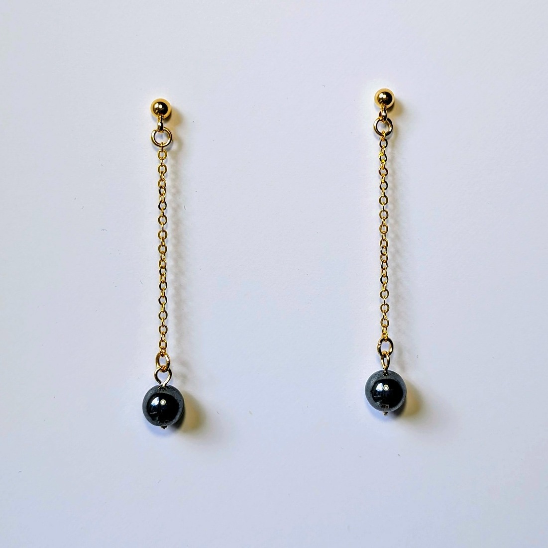 Boucles d\'oreilles dorées Hématite