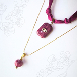 assemblage collier orchidée et collier intuition cala rossa
