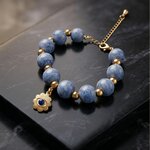 bracelet Amulette Céleste perles en béton bleu ciel charm oeil bleu acier inoxydable