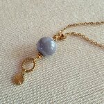 collier évasion détail pendentif