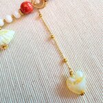 détails coeur collier coquillages et crustacées