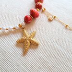 détails collier soleil de nacre pendentif étoile de mer strass acier inoxydable