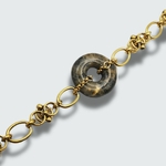 bracelet honeur avec disque bi en béton marbré avec incrustation de feuilles d'or pour femme