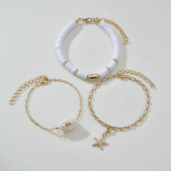 set de bracelets dorés et blancs femme