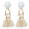 boucles d'oreilles blanches pendantes pompons