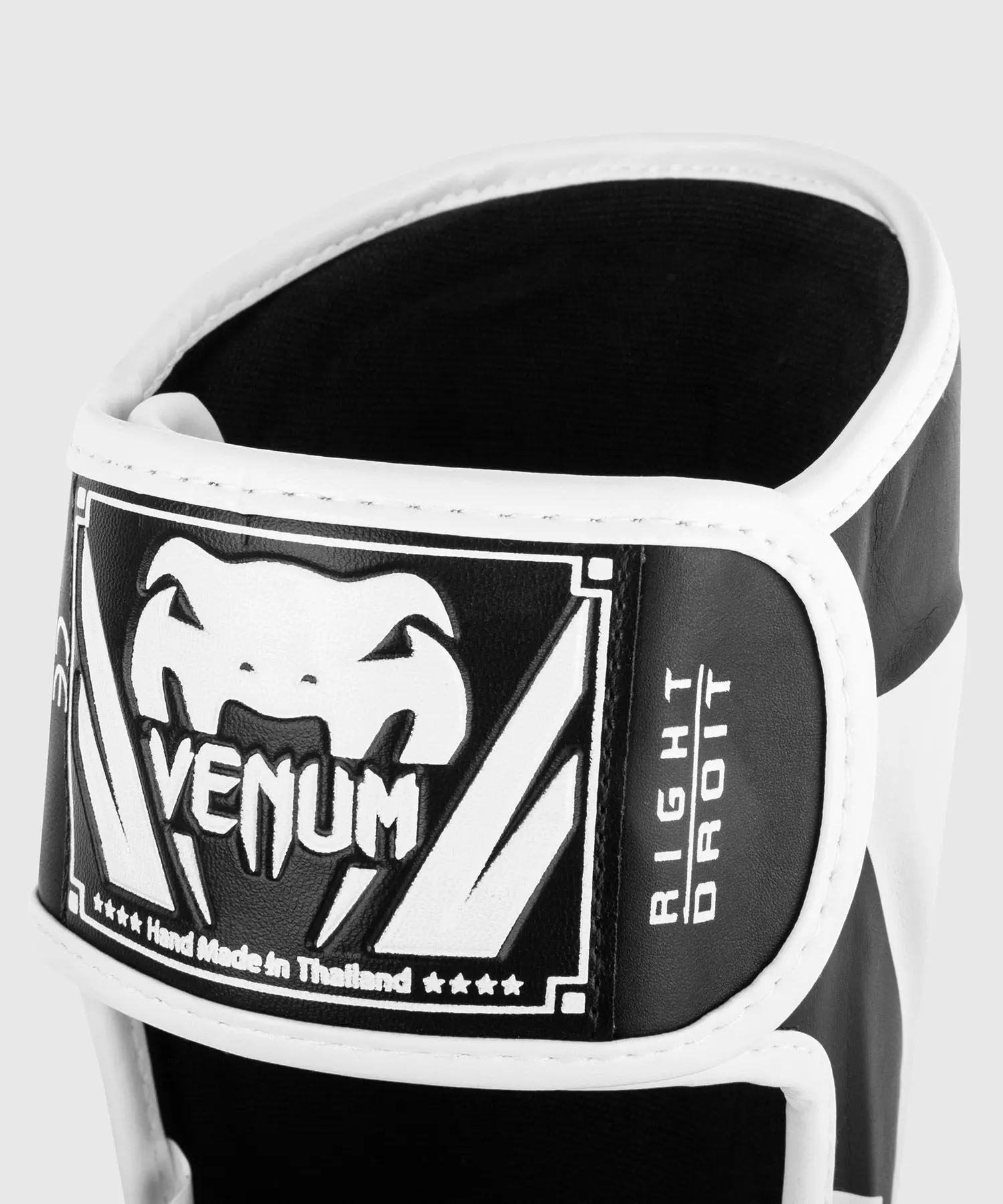 protege-tibias-et-pieds-elite-venum-noir-blanc