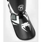 protege-tibias-contender-venum-noir-gris
