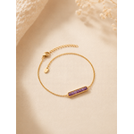 Bracelet Velia violet lavande et doré pour femme sur fond beige doux et chaleureux