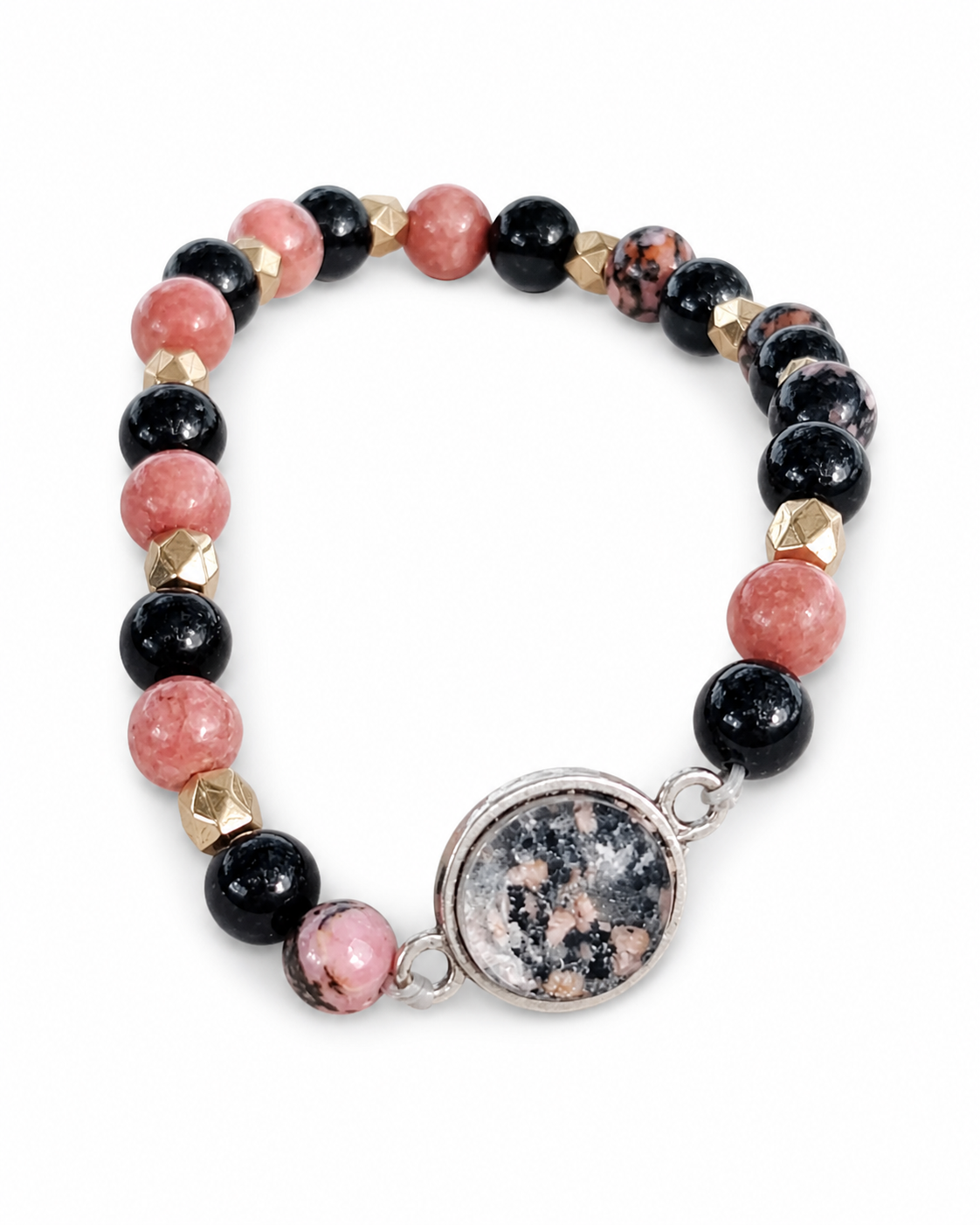Bracelet Rhodonite Tourmaline Noire détouré sur fond blanc, perles roses et noires, séparateurs dorés et cabochon rond argenté.