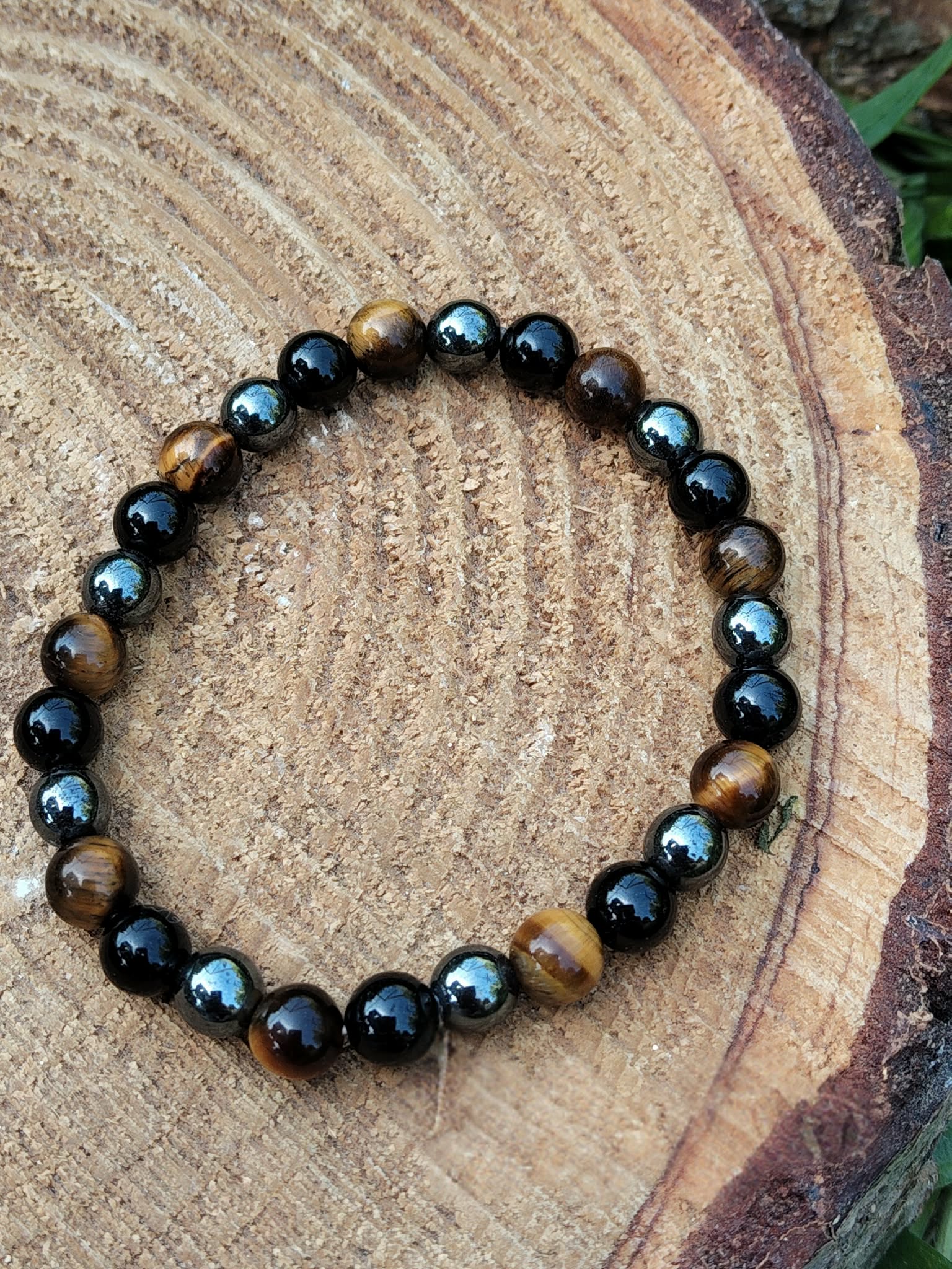 Bracelet en pierres naturelles 6 mm sur bois brut, obsidienne noire, œil de tigre et hématite pour protection renforcée, courage et équilibre