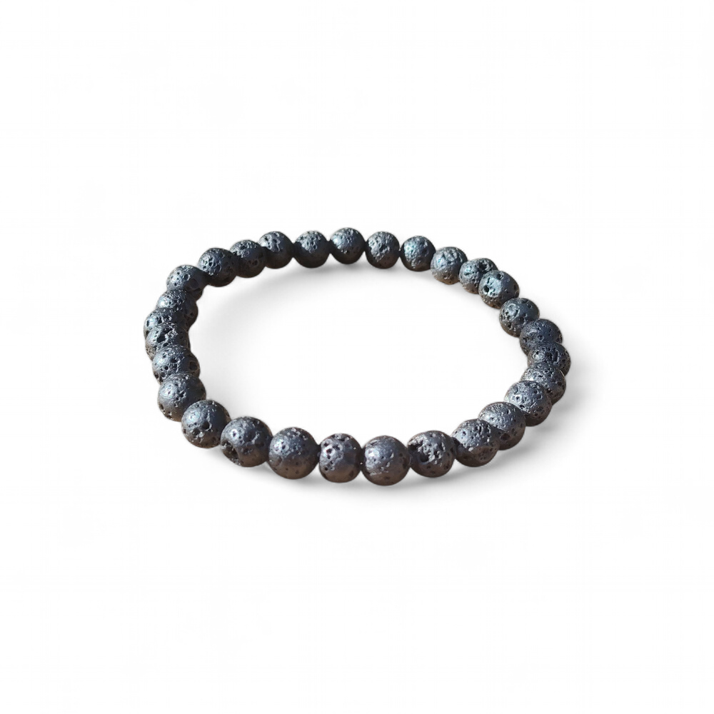 Bracelet en Pierre de Lave 6 mm sur fond blanc, perles volcaniques noires, stabilité, calme intérieur et recentrage.