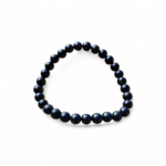Bracelet tourmaline noire sur fond blanc, perles polies 6 mm en pierre naturelle pour recentrage, stabilité intérieure et présence affirmée