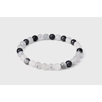 Bracelet Tourmaline noire et Quartz tourmaliné sur fond blanc, perles 6 mm noires et blanches pour clarté intérieure et équilibre.