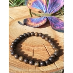 Perles de bronzite naturelle en bracelet, nuances chocolat, bronze et doré sombre pour accompagner paix intérieure et force calme.