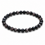Bracelet Obsidienne Argentée détouré sur fond blanc, perles noires polies montées sur élastique pour discernement et clarté intérieure.