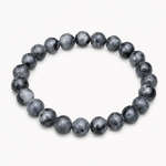 Bracelet Larvikite 8 mm détouré sur fond clair, perles rondes gris noir marbrées, clarté mentale et préservation énergétique.