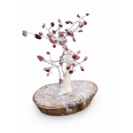 Création minérale en Rhodonite posée sur socle bois, pierres rose brun en feuillage, ambiance cœur apaisé et réconfort.