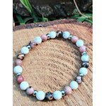 Bracelet howlite veinée et rhodonite rose sur bois, équilibre des émotions, réconfort affectif et paix du cœur