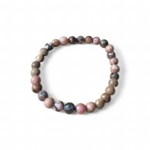Bracelet rhodonite sur fond blanc, perles rondes 6 mm rose et noir en pierre naturelle pour compassion, douceur affective et stabilité émotionnelle