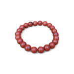 Bracelet jaspe rouge 8 mm sur fond blanc, perles rouge brique aux reflets naturels, ancrage, vitalité et force intérieure
