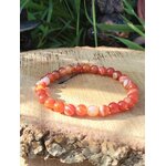 Bracelet cornaline sur tranche de bois, perles orange naturelles pour passage à l’action, volonté stable et vitalité rayonnante