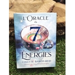 L’Oracle des 7 Énergies (Colette Baron-Reid) – coffret divinatoire en français, boîte vue de face posée sur surface naturelle type pierre/bois, ambiance ésotérique.