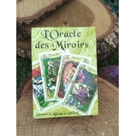 Oracle des miroirs Éditions Trajectoire, coffret de 53 cartes divinatoires, posé sur rondin de bois avec fond sombre ésotérique.