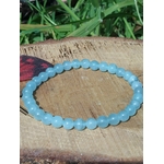 Bracelet Aigue-Marine 6 mm sur rondin de bois avec décor végétal, perles bleu mer translucides, paix intérieure et retour au calme.