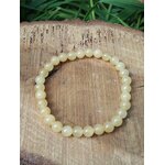 Bracelet calcite jaune sur bois clair avec feuillage vert, perles 6 mm en pierre naturelle pour bonne humeur, lucidité et vitalité sereine