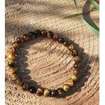 Bracelet Œil de Tigre 6 mm sur élastique, perles doré-brun, rondin de bois et végétation, volonté et concentration.